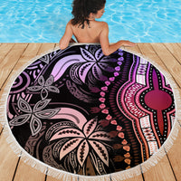 Round beach blanket with fringe edge, black base with purple and pink central emblem