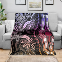 Pastel dashiki pattern blanket draped on sofa, black with purple pink and ornate border