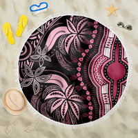Round pink beach blanket with white tassel fringe and black tribal medallion pattern