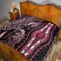 Pink and black dashiki quilt laid on bed with floral medallion and vertical striped design