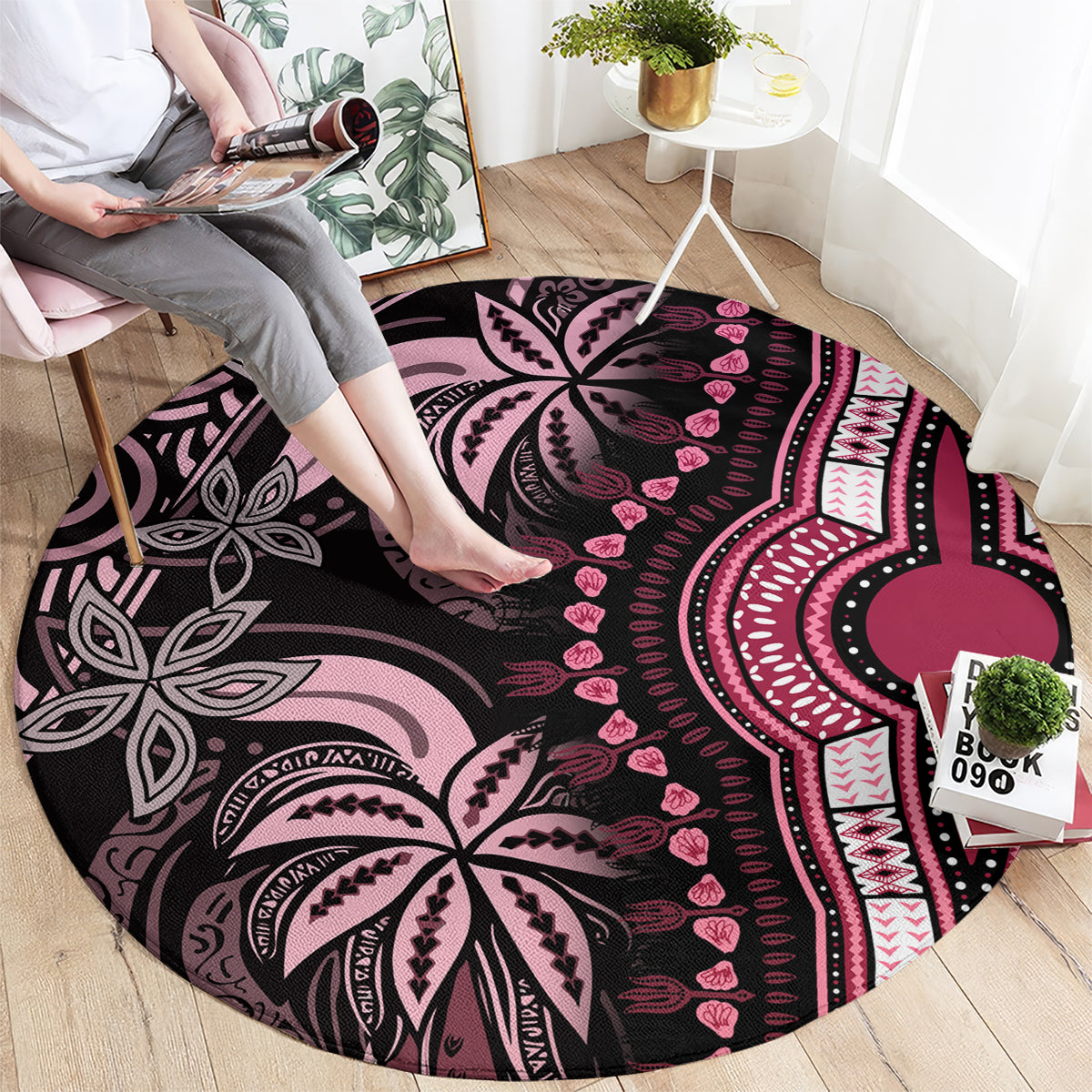 Round patterned carpet rug with black base and pink/magenta tribal motifs
