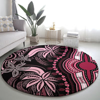 Round dashiki round rug featuring black, pink, and magenta mandala-like design