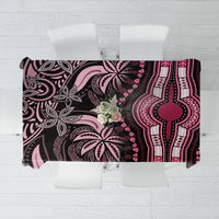 Square tablecloth with dark geometric-and-floral pattern and pink accents