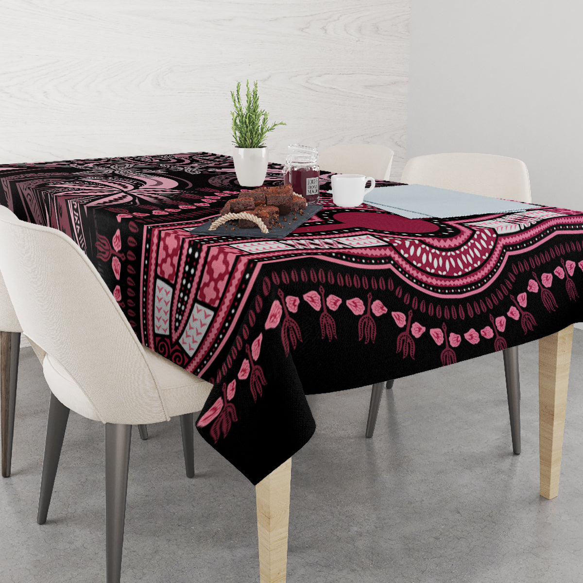 Rectangular tablecloth with dark center panel, pink motifs, and patterned border