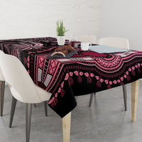 Rectangular tablecloth with dark center panel, pink motifs, and patterned border