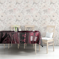 Rectangular tablecloth with dark ornate print and pink leaf-and-dot motifs