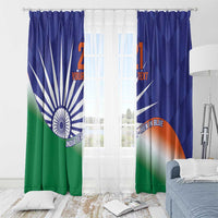 Blue India flag-style curtains with Ashoka Chakra and diagonal rays, hanging over window.