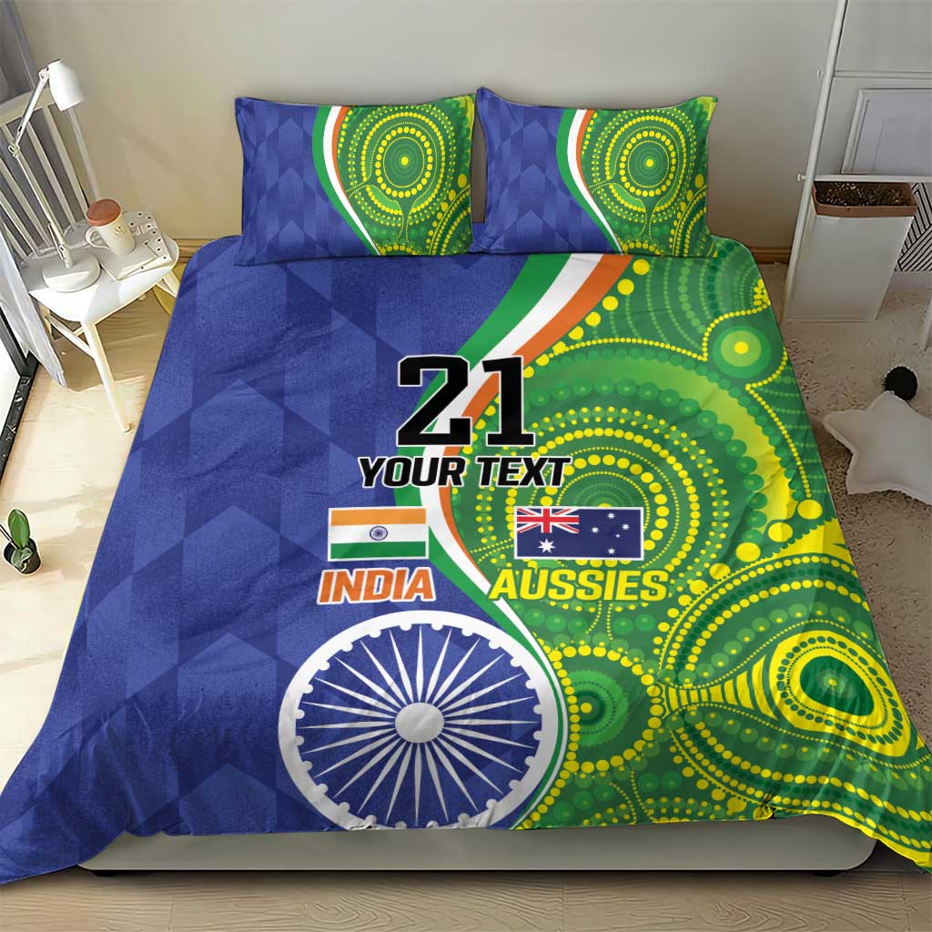 Blue and green comforter with two pillows featuring '21', flag graphics, and circular artwork