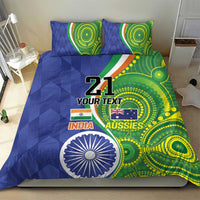 Blue and green comforter with two pillows featuring '21', flag graphics, and circular artwork