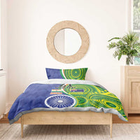 Blue and green bedding set on bed with pillow, circular flag emblem and abstract patterns