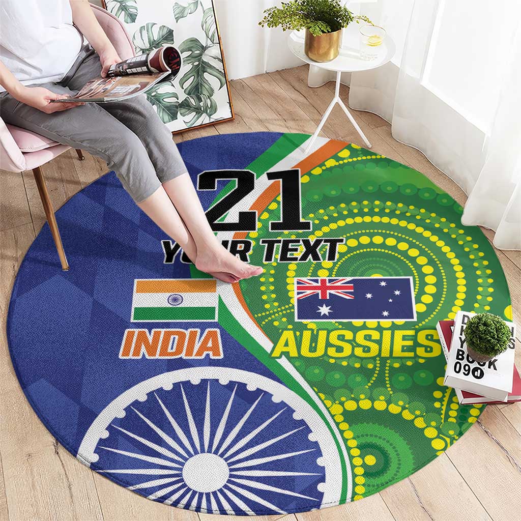 Round carpet with blue-green INDIA and AUSSIES graphic, large '21' center