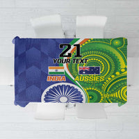 Blue-green tablecloth with cricket-themed flags and circular motifs