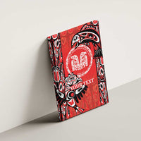 Red canvas wall art tilted on wall with Haida-style emblem and “YOUR TEXT”