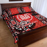Red quilt bed set with black and white tattoo design, central circular badge, and text