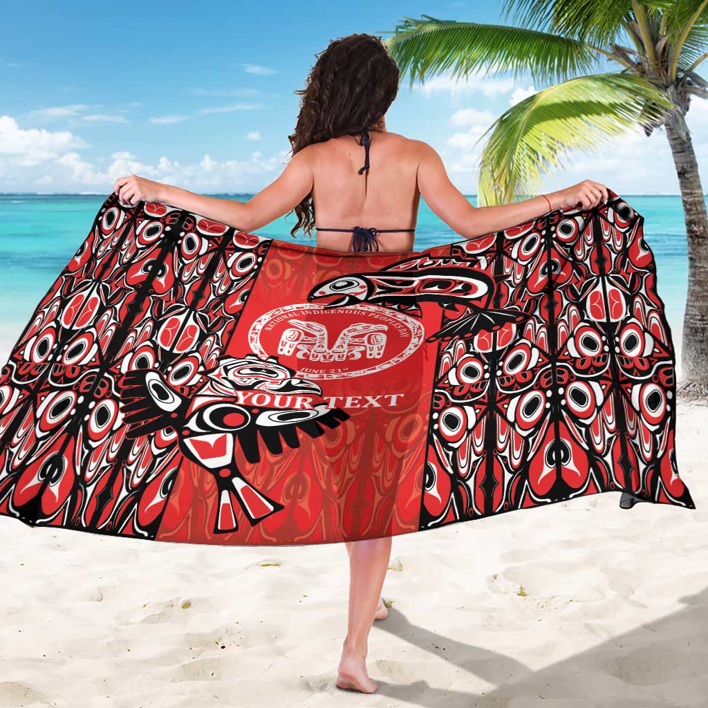 Red tribal-print sarong with circular emblem and YOUR TEXT, held open at sides