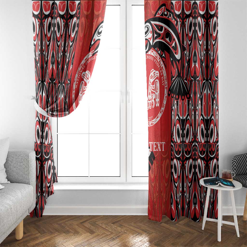 Red and black patterned curtain panels with circular emblem, hanging on a window