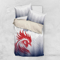 White, navy bedding set with red rooster graphic and chevron pillows