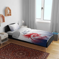 White and navy bedding set with red rooster graphic and France/your text on bed
