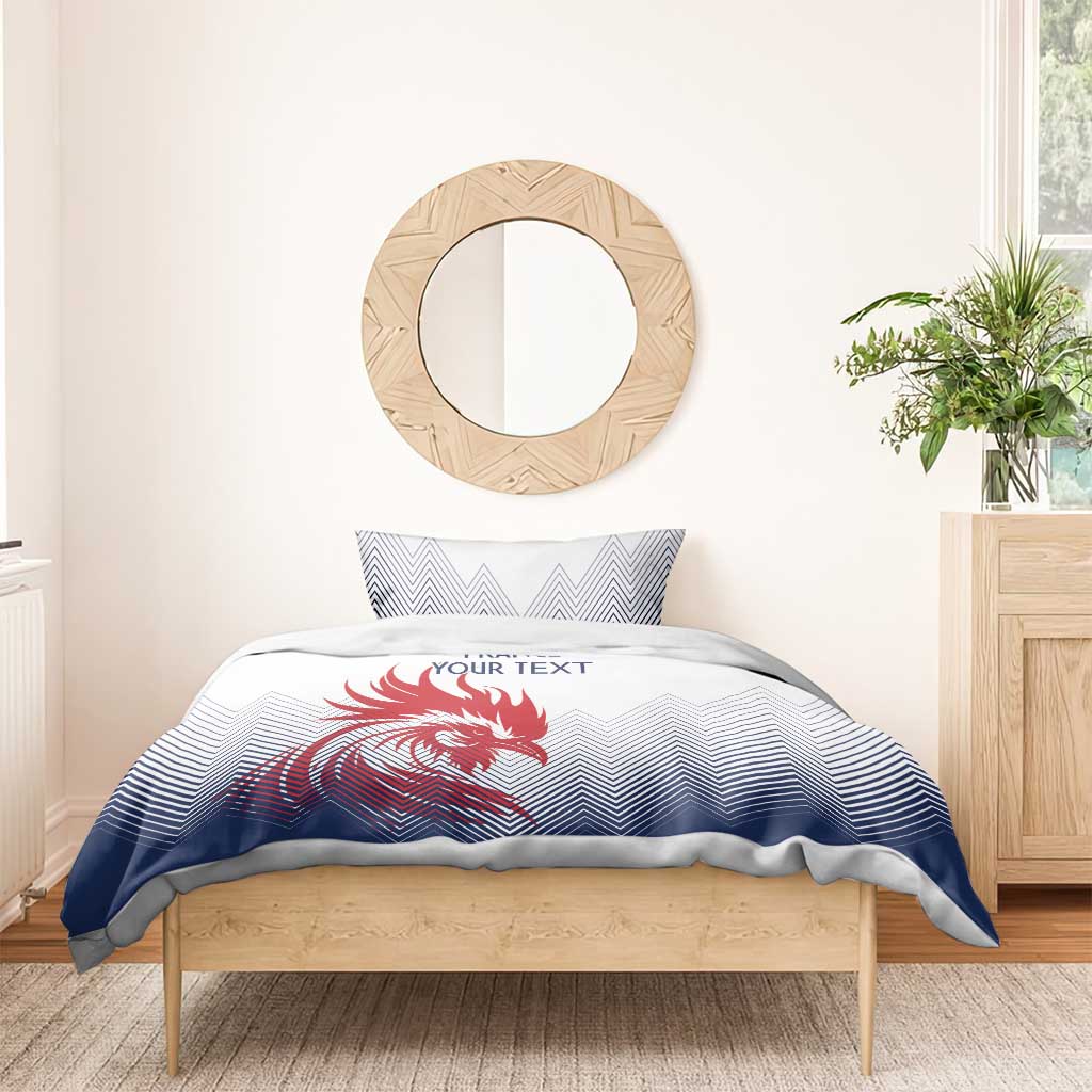 White and navy bedding set with red rooster graphic and zigzag chevrons