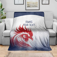 France rugby blanket draped on couch, white and dark blue with red rooster and custom text