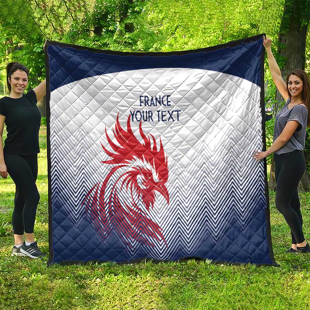 Navy and white quilt spread outdoors, red rooster emblem and custom text in center