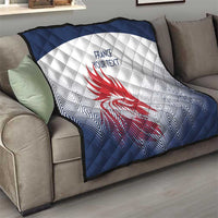 Navy and white quilt blanket with red rooster emblem and custom text on living room sofa