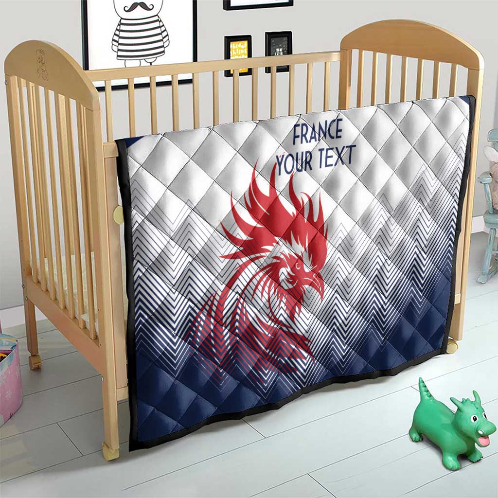 Navy and white quilt on crib, red rooster emblem and custom text at center