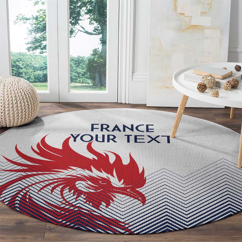 Round rug with red rooster design, blue zigzag chevrons, and “FRANCE”/“YOUR TEXT”.