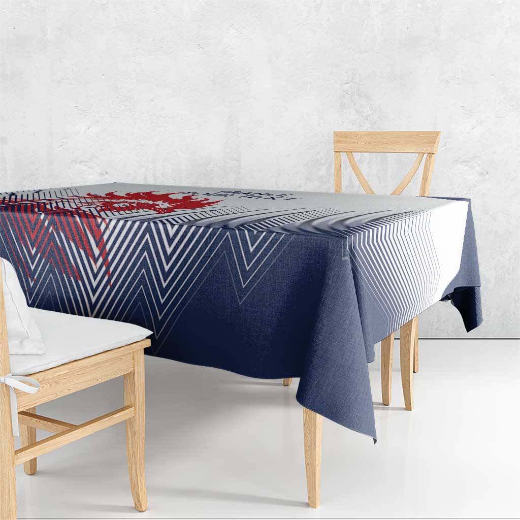 Navy and white chevron tablecloth draped over dining table