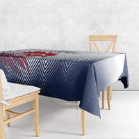 Navy and white chevron tablecloth draped over dining table