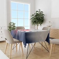 Navy and white chevron tablecloth on dining table with four chairs