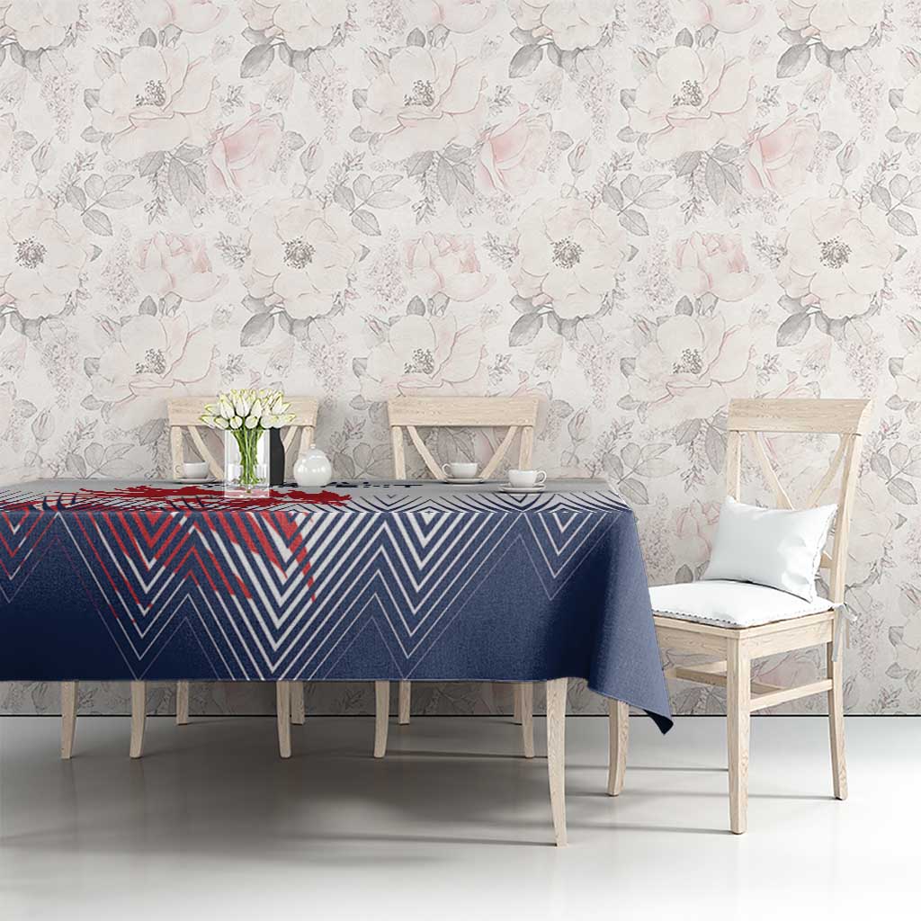 Navy and white chevron tablecloth on dining table with two chairs