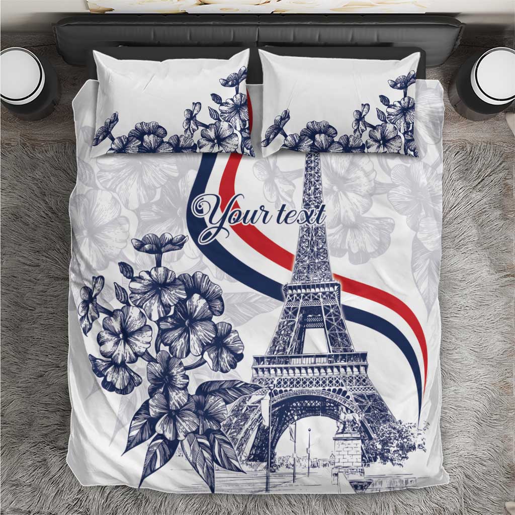 White duvet cover set with blue floral and Eiffel Tower print, two matching pillowcases