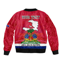 Red bomber jacket back with 'YOUR TEXT', Haiti emblem and 'Libete Egalite Fraternite' band.