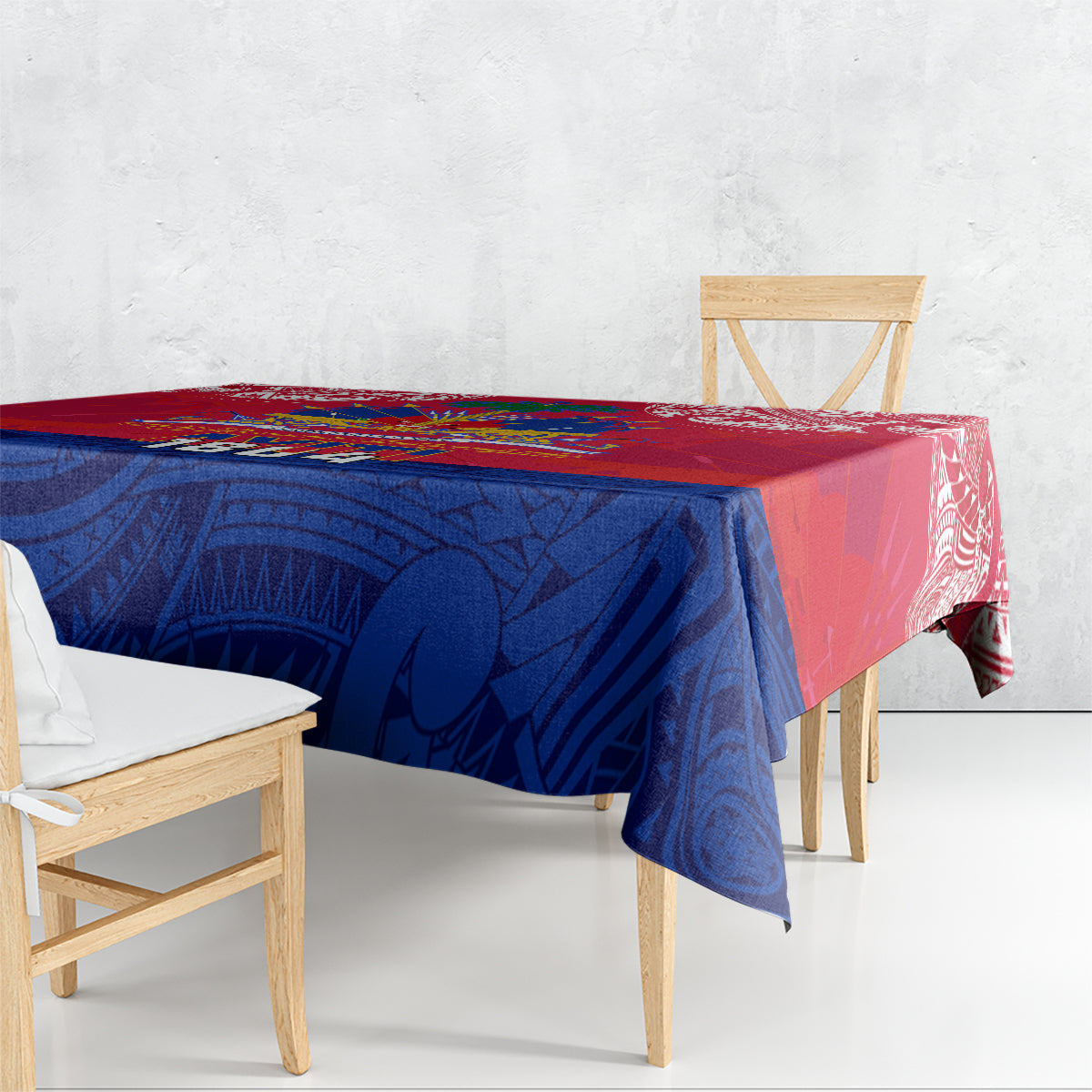 Red and blue patterned tablecloth with Polynesian motifs, covering table top