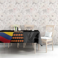 Black football-themed tablecloth with Colombia flag stripe and orange circle pattern
