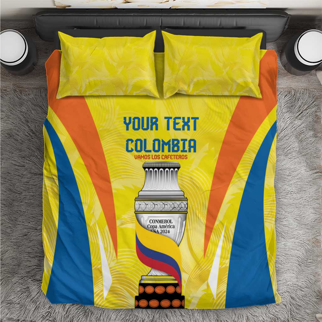Yellow, orange and blue bedding set with two pillowcases, centered on gray rug