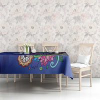 Blue tablecloth with colorful floral pattern, on dining table in room