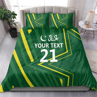 Green duvet cover and pillow covers with yellow geometric lines and “YOUR TEXT 21” text