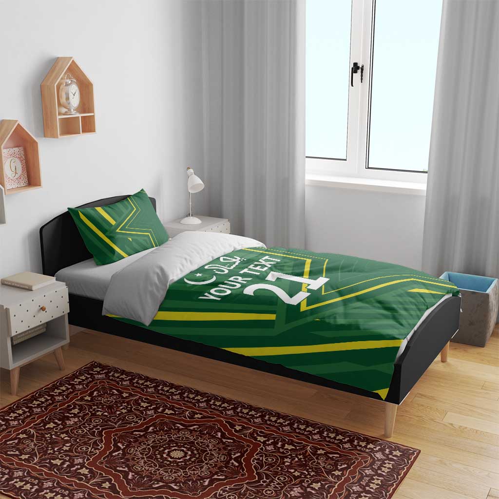 Green duvet cover on bed with yellow graphic lines and “YOUR TEXT 21” white print