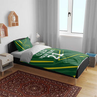Green duvet cover on bed with yellow graphic lines and “YOUR TEXT 21” white print