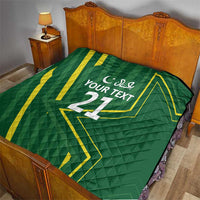 Green custom quilt with yellow geometric pattern and 'YOUR TEXT' centered