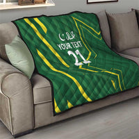 Green custom quilt with yellow geometric pattern and 'YOUR TEXT 11'