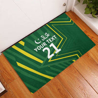 Green custom rubber doormat with “Your Text” and large number 11, yellow geometric accents