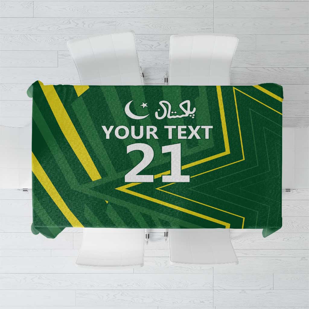 Green tablecloth with gold geometric design, crescent icon, and number 21