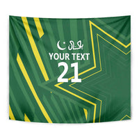 Green custom tapestry close-up with yellow geometric lines and Arabic text, number 21