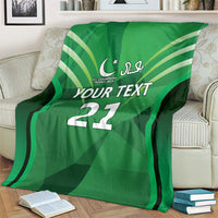 Green cricket custom blanket on sofa showing 'YOUR TEXT 22' and stripe graphics