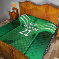Green quilt blanket on bed with jersey stripes, 'YOUR TEXT' and number 21