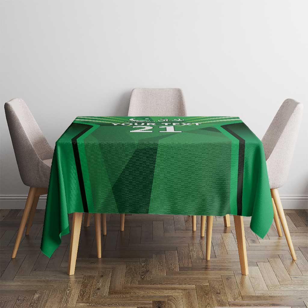 Green tablecloth with sporty design and number 21 on the center, on dining table.