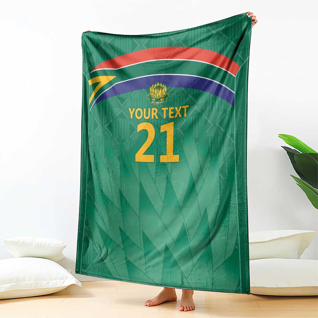 Green custom cricket blanket with flag stripes, Proteas crest, and 'YOUR TEXT 21'.